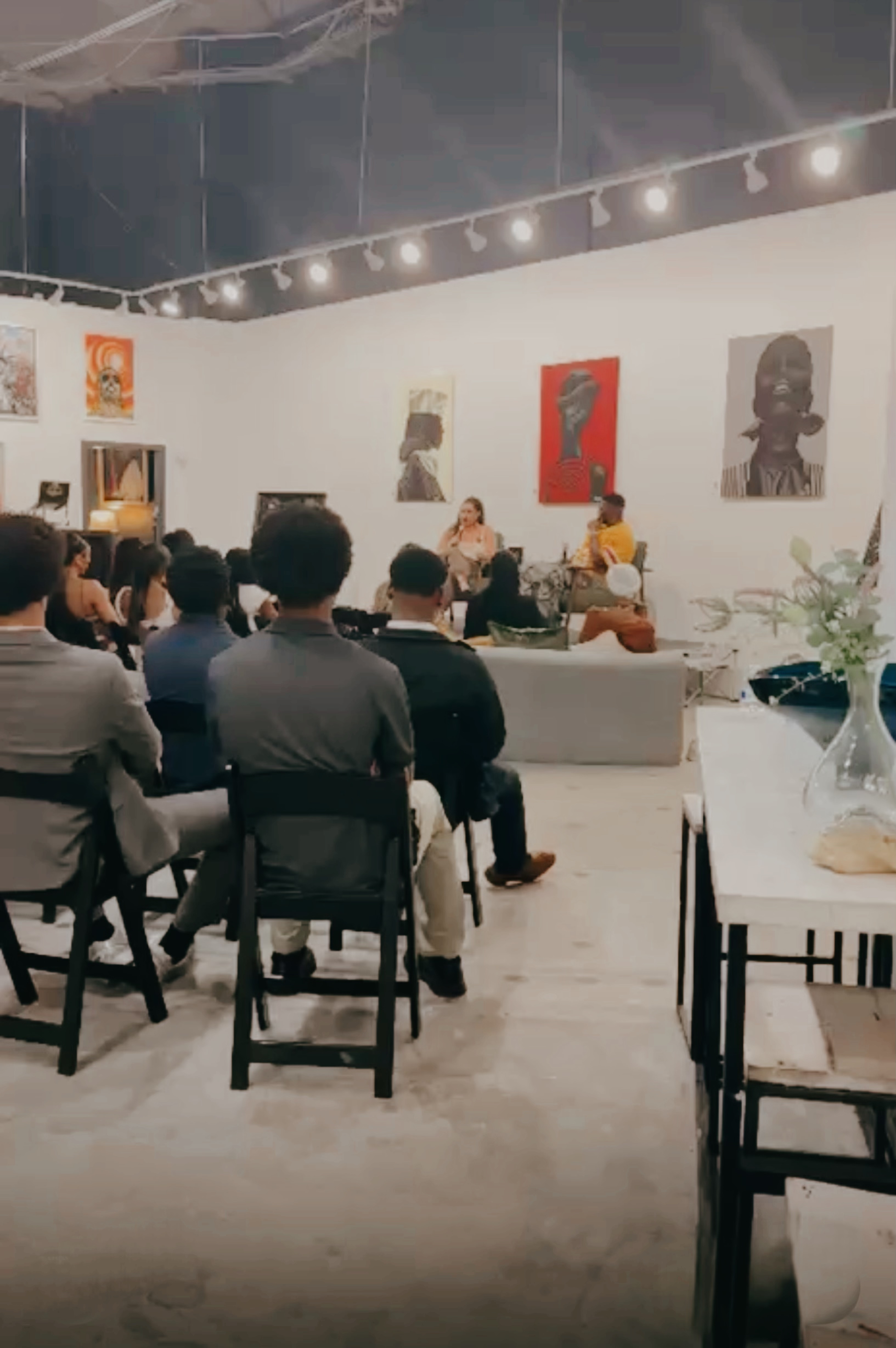 Angelica Robles speaking on a panel to a full audience